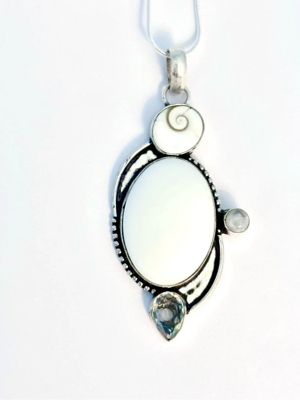 White Opal, Shiva Eye, Mystic Topaz and Moonstone pendant on silver chain.